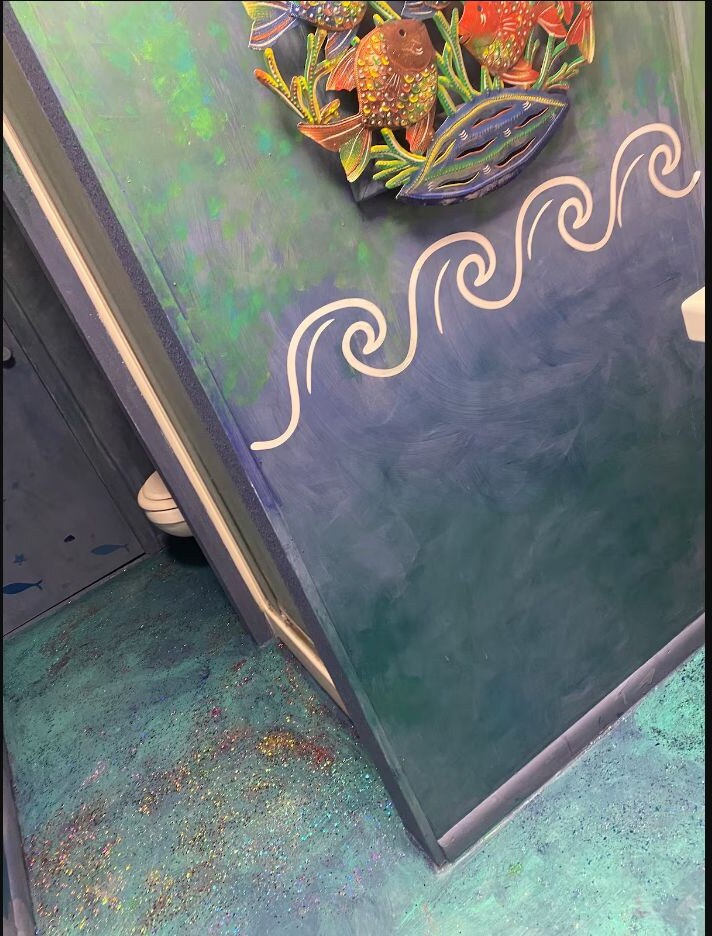 Ocean inspired hallway leading to the bathrooms