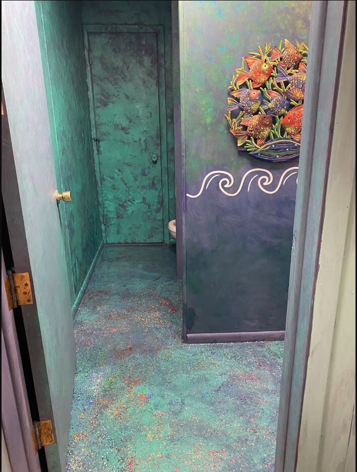 Ocean themed bathroom entry and painted floor