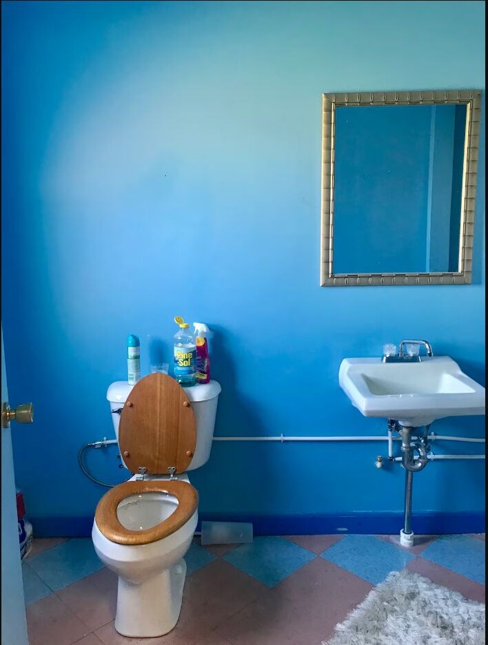 Private bathroom with vanity and shower curtain